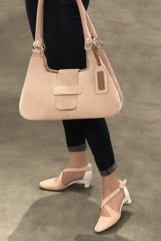 Powder pink and off white women's open side shoes, with crossed straps. Round toe. Low kitten heels. Worn view - Florence KOOIJMAN